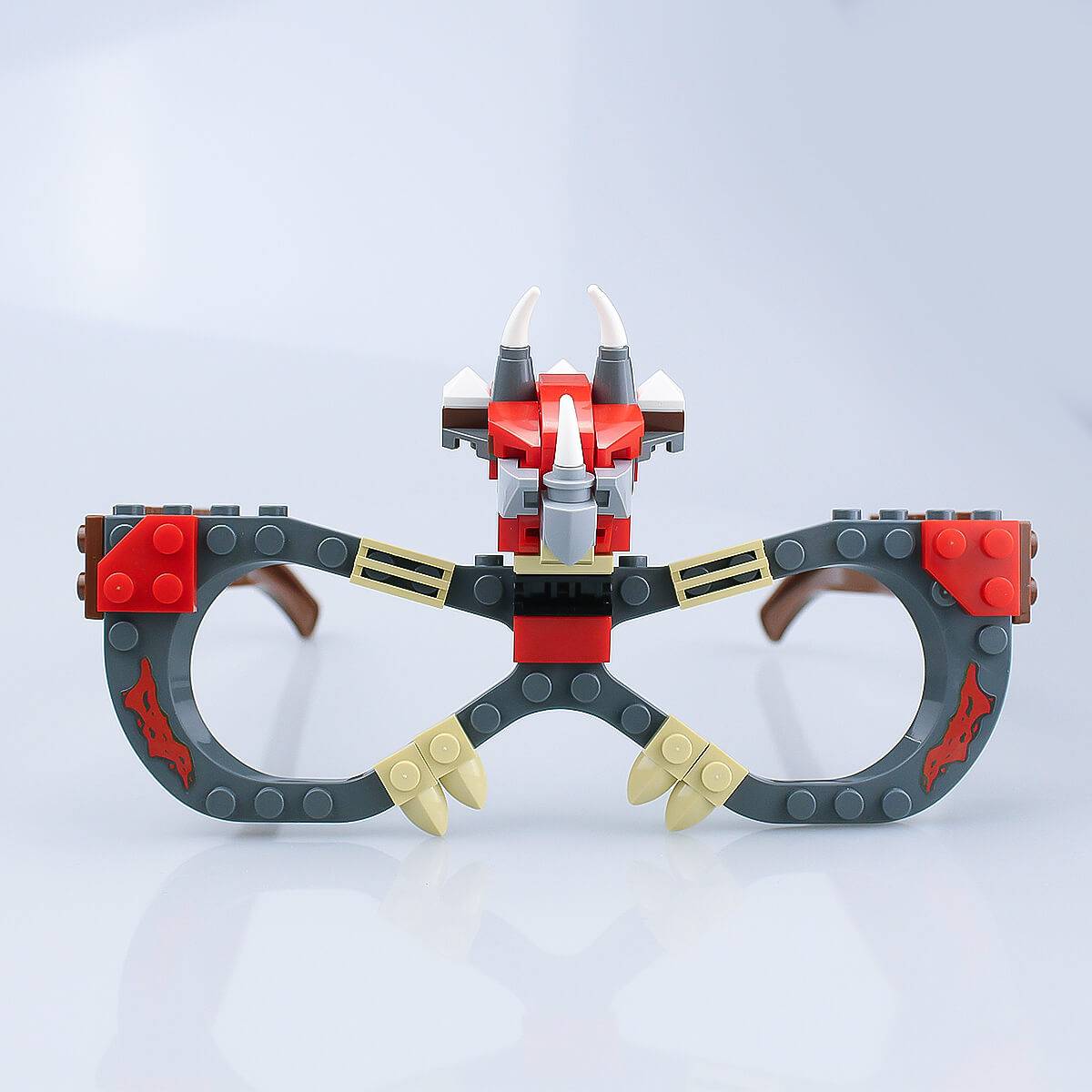 Fully assembled dinosaur-themed Kids DIY Glasses Building Block Set with gray and brown frames and triceratops details. Fun and educational toy for kids.