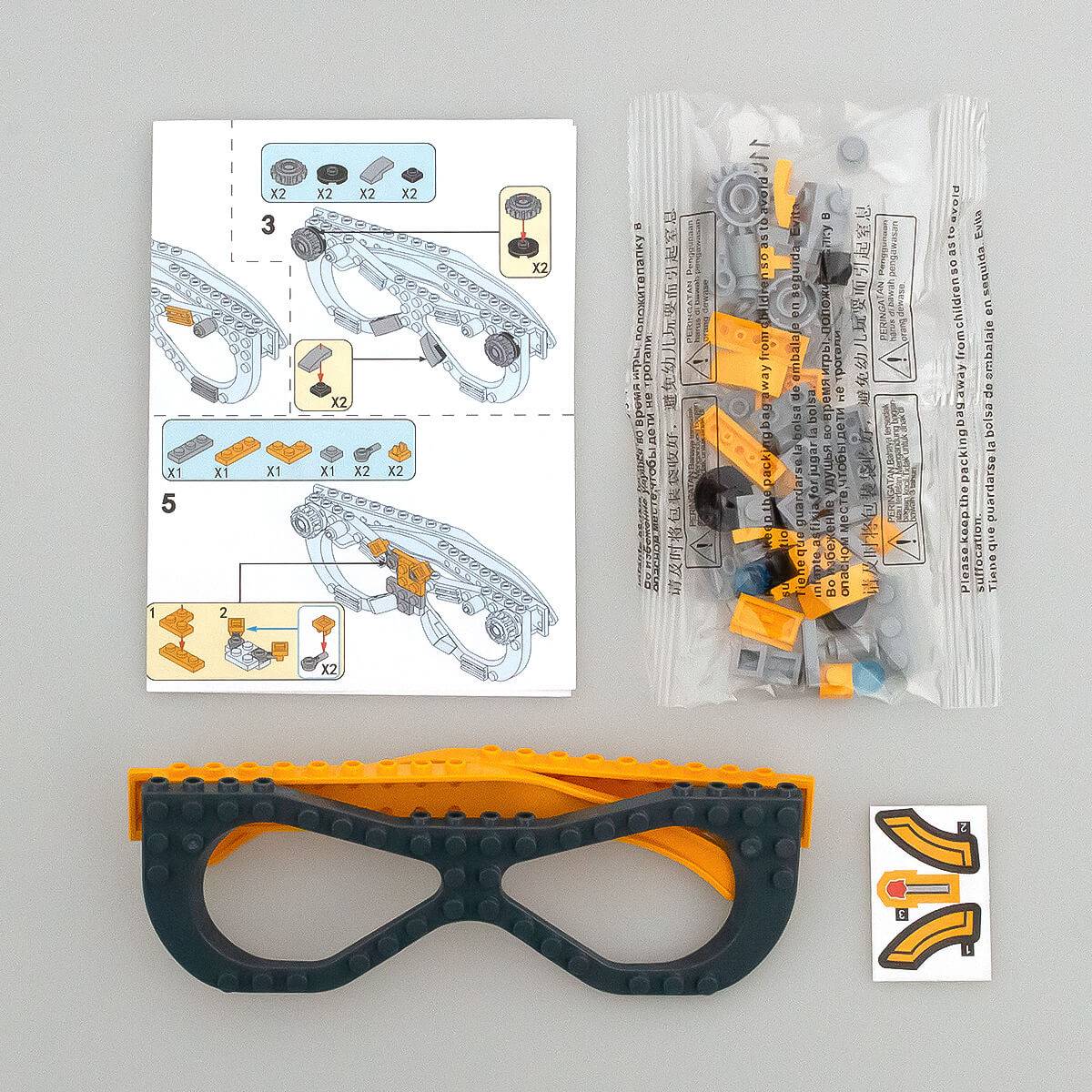 Instruction manual and building pieces for the robot-style Kids DIY Glasses Building Block Set. Easy-to-follow guide for creative assembly.