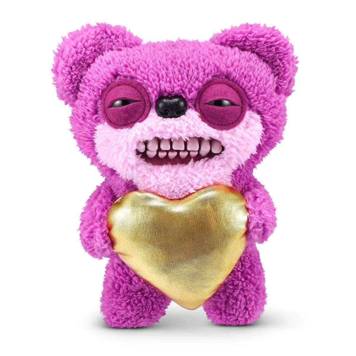 FUGGLER Soft Plush Toy in pink bear design holding a gold heart. A cute and creepy plush for Valentine's Day or collectors.