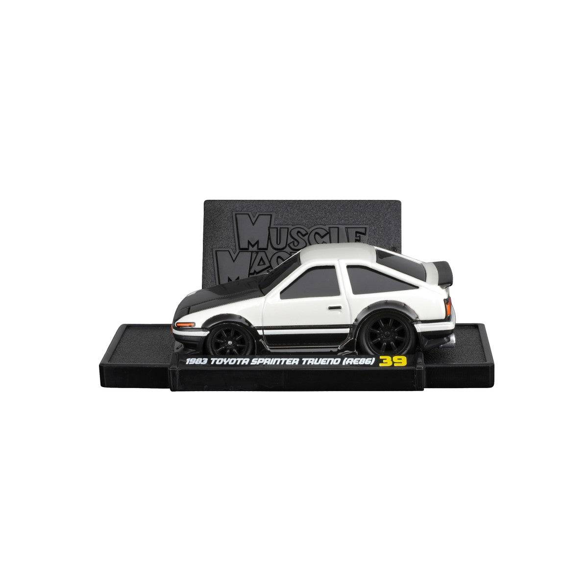 1983 Toyota Sprinter Trueno AE86 diecast model on a display stand, showcasing its classic two-tone design and detailed bodywork.