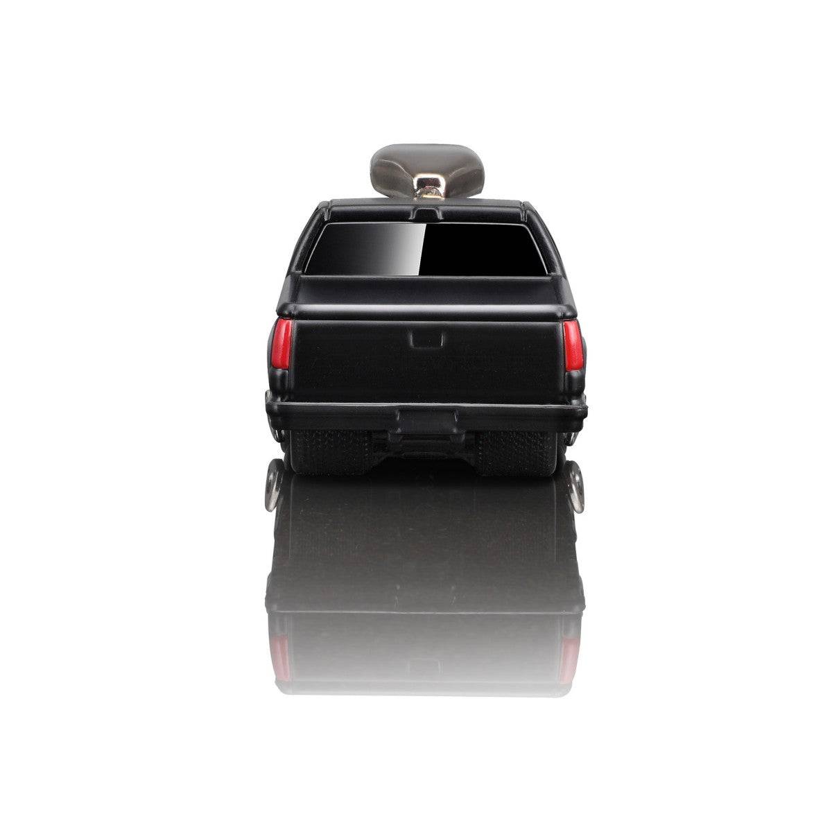 Rear view of the Maisto Muscle Machines 1993 Chevrolet 454 SS Pickup diecast model, featuring a sleek tailgate and detailed taillights.
