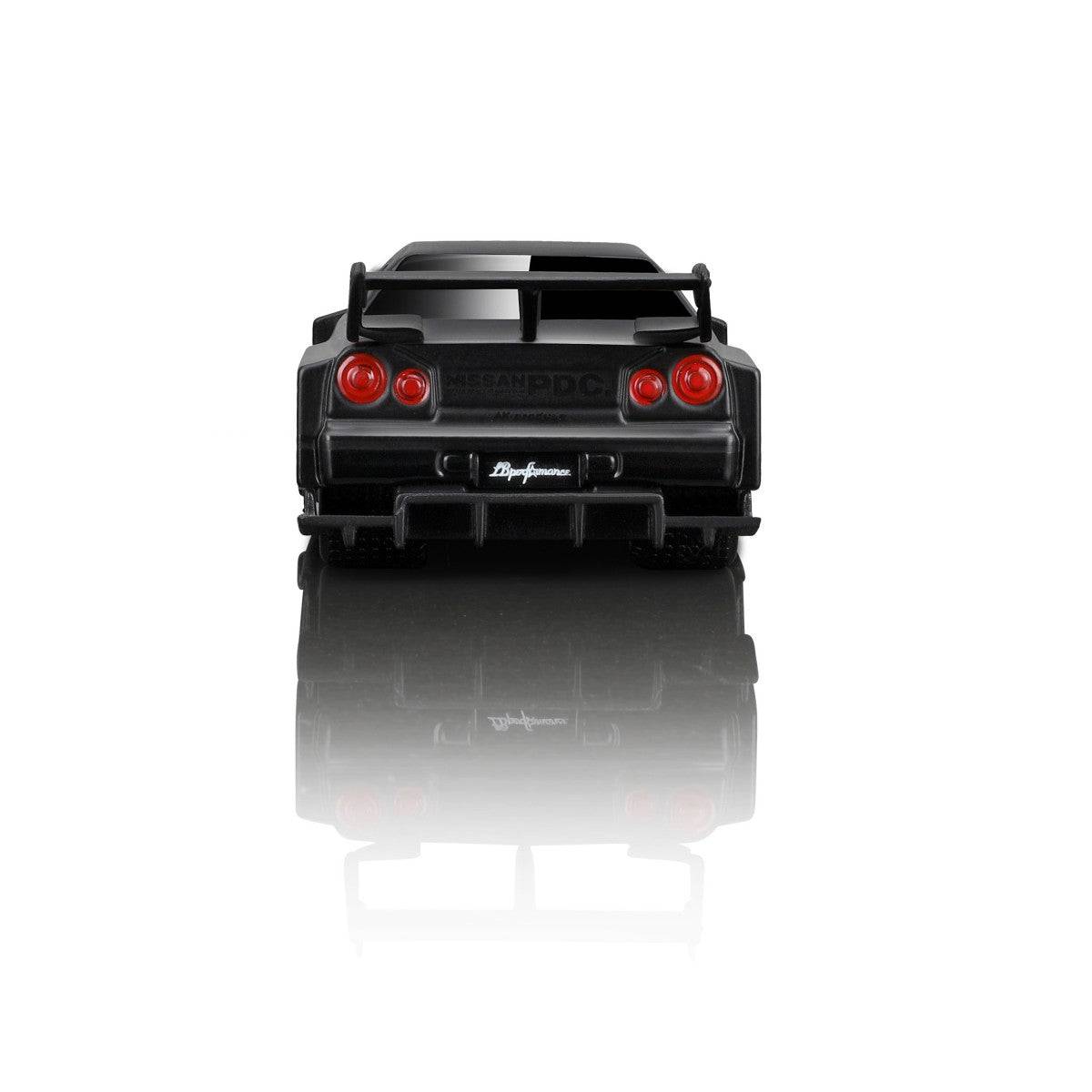Rear view of the Maisto Muscle Machines Liberty Walk Nissan Skyline GT-R R34 diecast model, featuring a large wing and detailed taillights.