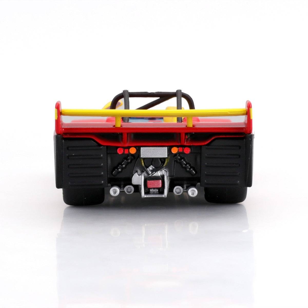 Rear close-up of Bburago 1:43 Ferrari 312 P 1972 alloy model car showcasing exhaust system, aerodynamic wing, and racing number for authenticity.