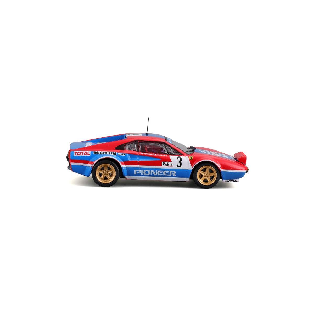 Left side view of Bburago 1:43 Ferrari 308 GTB 1982 model car featuring detailed sponsor logos and rally-ready design.