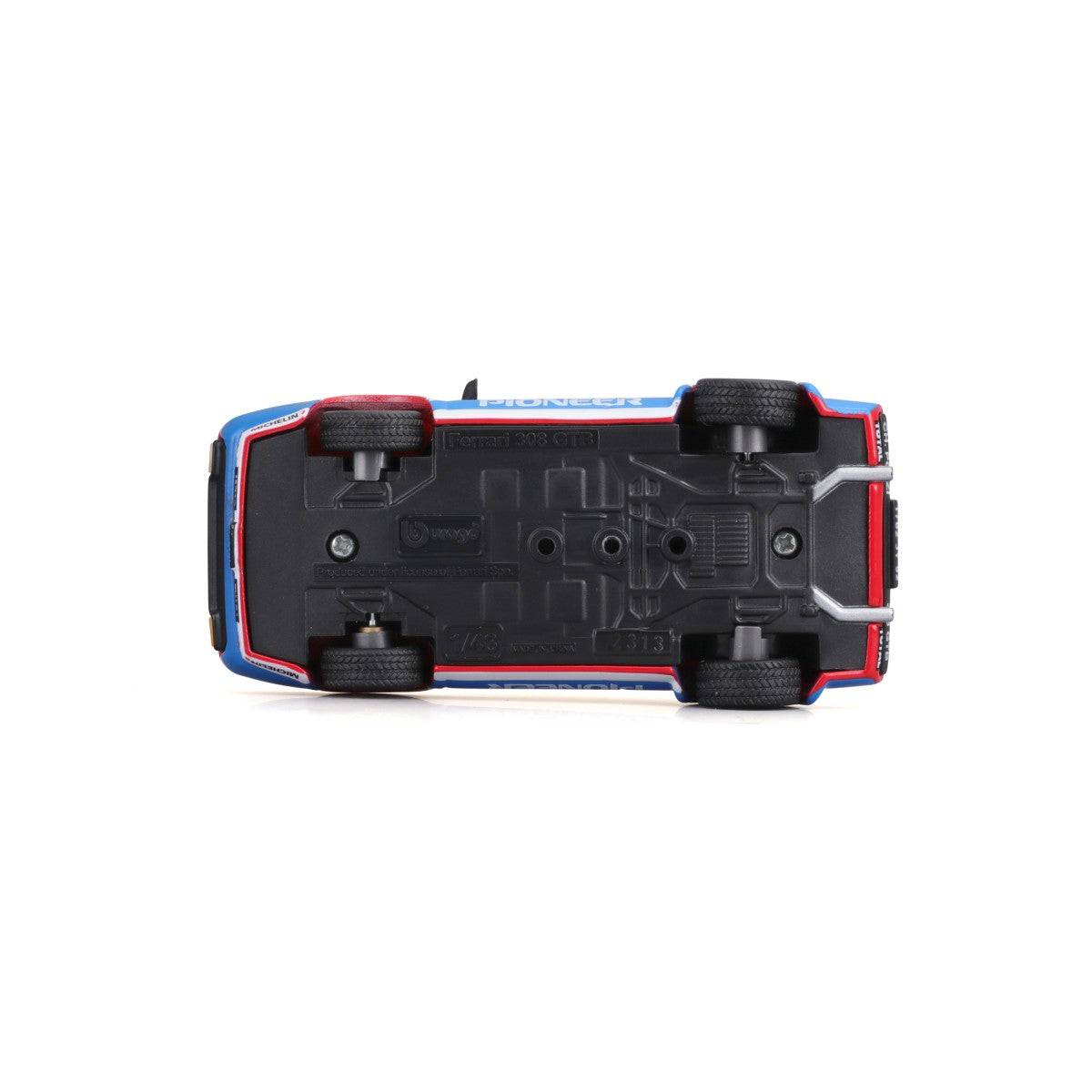 Underside view of Bburago 1:43 Ferrari 308 GTB 1982 model car showing chassis details, wheels, and manufacturer markings.