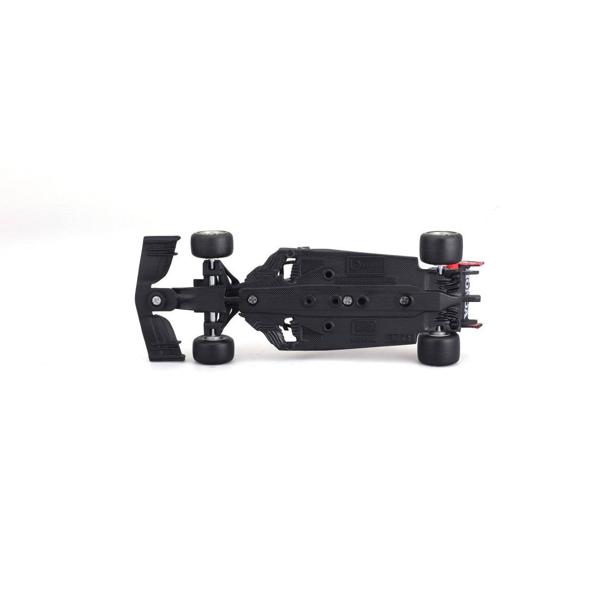 Underside view of Bburago 1:43 F1 Red Bull Racing RB16B #33 Max Verstappen model, showcasing chassis details and structural design.