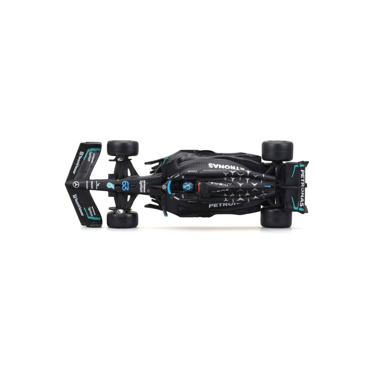 Top-down view of Bburago 1:43 F1 Mercedes-AMG Petronas W14 #63 George Russell, displaying aerodynamic contours and sponsor logos.