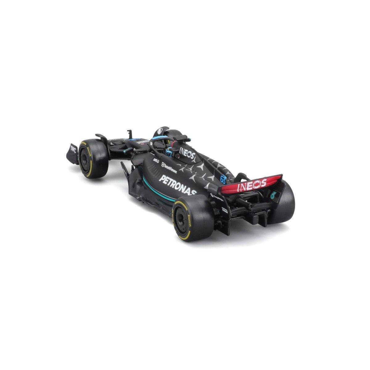 Rear-left perspective of Bburago 1:43 F1 Mercedes-AMG Petronas W14 #63 George Russell, displaying aerodynamic elements and tire details.