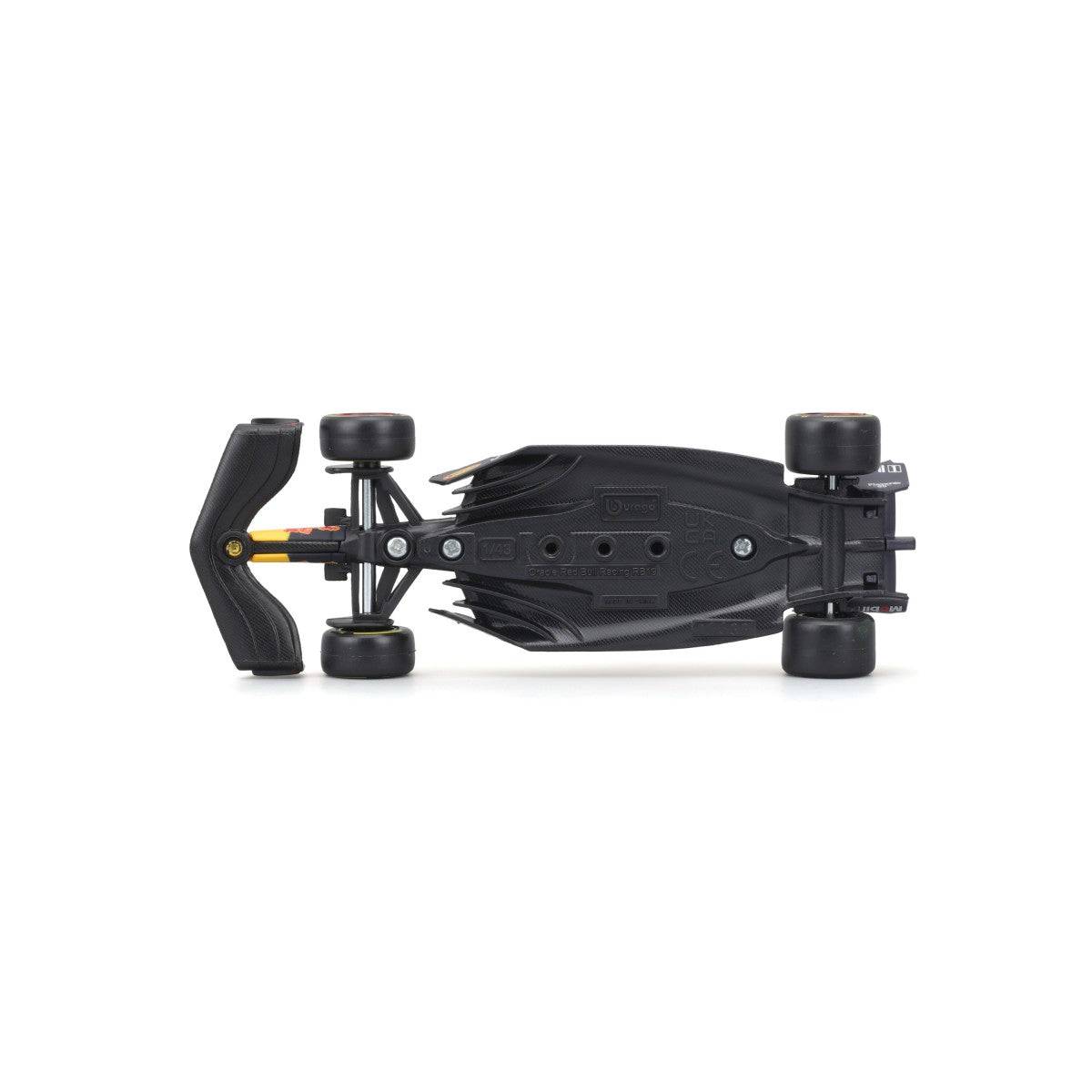 Underside view of Bburago 1:43 F1 Car Model 2023 Red Bull Racing RB19 #11 Sergio Pérez, showcasing chassis details and manufacturing precision.