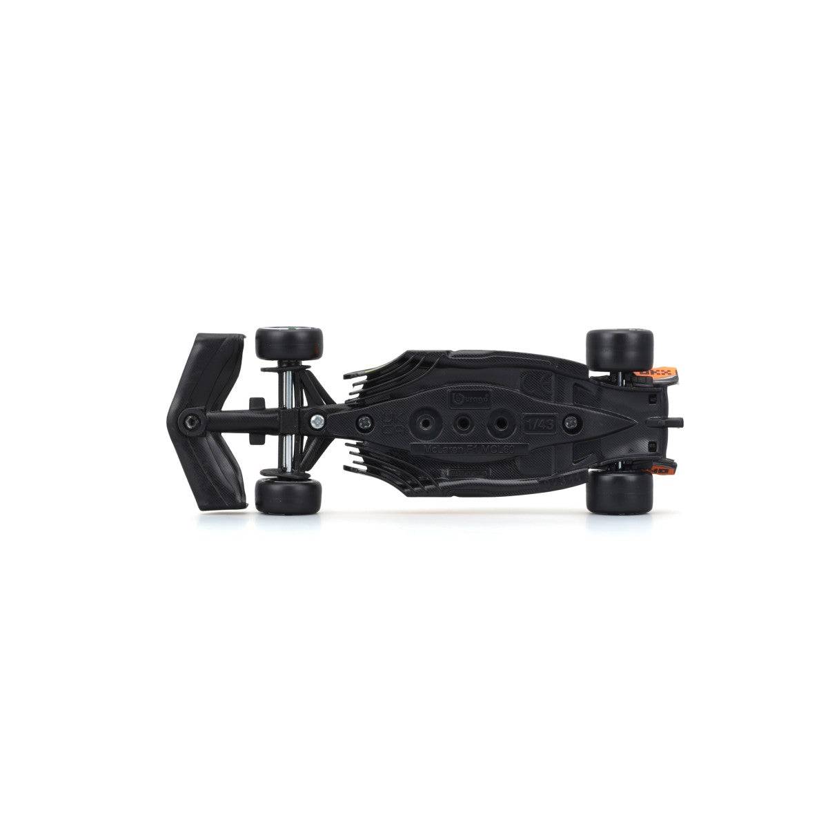 Underside view of the Bburago 1:43 F1 Car Model 2023 McLaren MCL60 #81 Oscar Piastri. Displays chassis details and structural design.