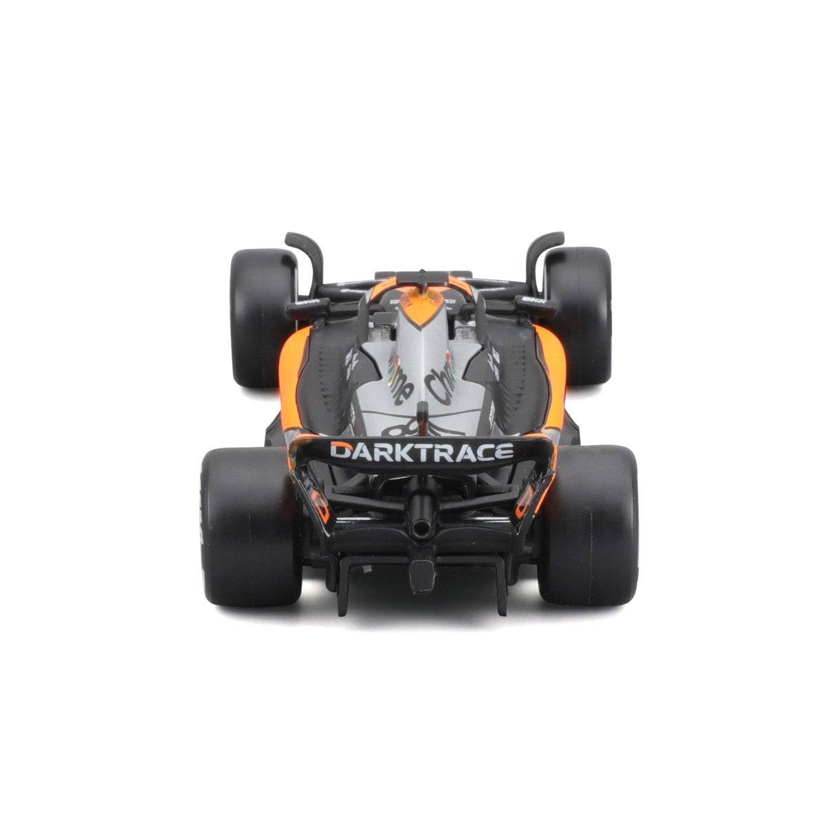 Rear view of the Bburago 1:43 F1 Car Model 2023 McLaren MCL60 #81 Oscar Piastri. Showcases aerodynamic design and rear wing details.