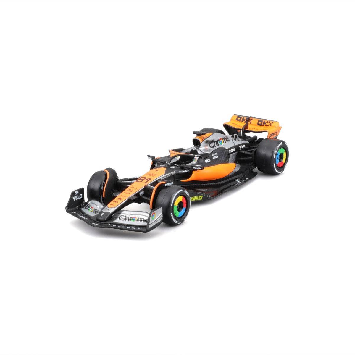 Angled front-left view of the Bburago 1:43 F1 Car Model 2023 McLaren MCL60 #81 Oscar Piastri. A detailed diecast replica for F1 collectors.