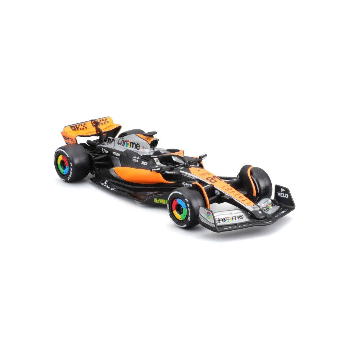 Angled front-right view of the Bburago 1:43 F1 Car Model 2023 McLaren MCL60 #81 Oscar Piastri. Features realistic design and sponsor decals.
