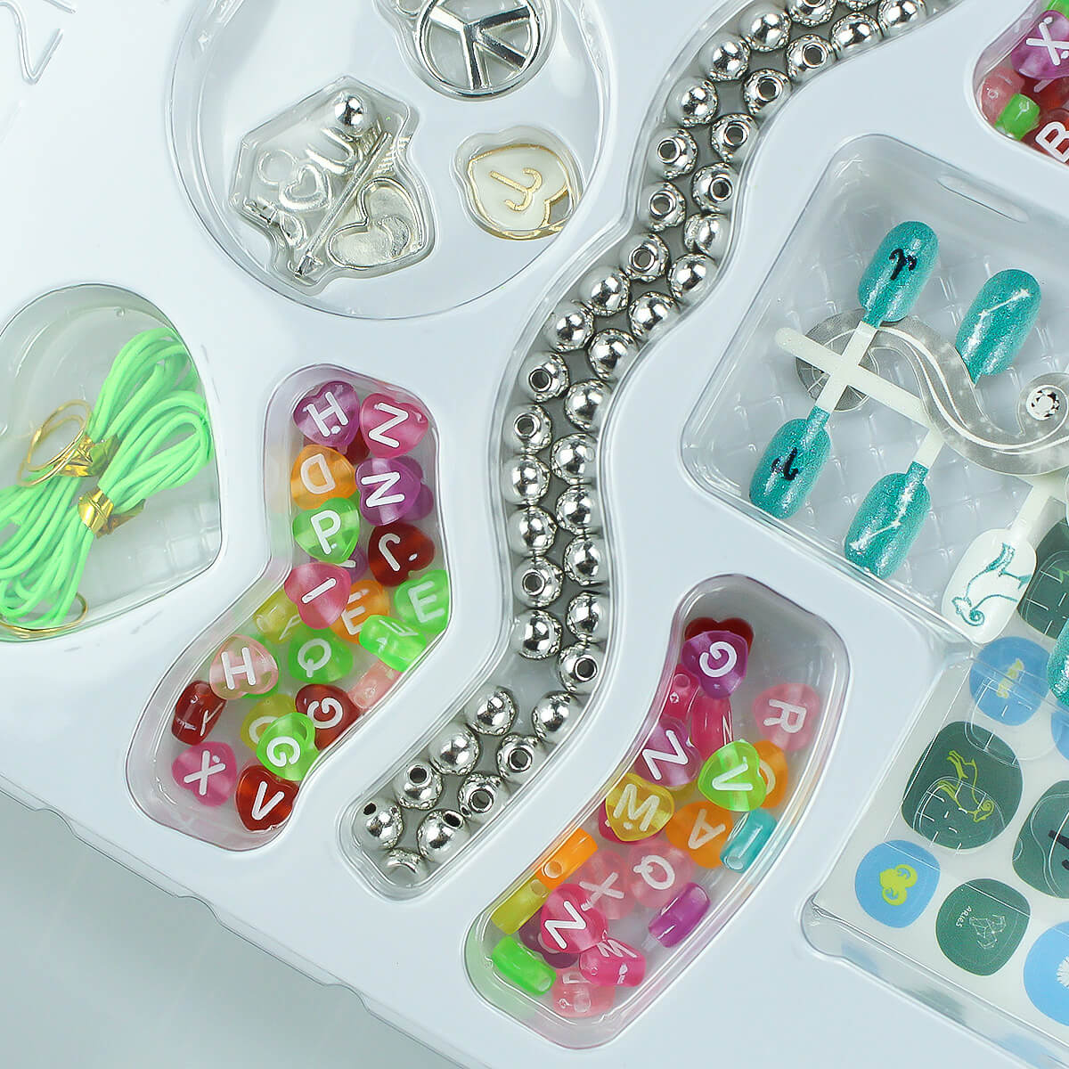 12 Zodiac Signs Kids Nail Art Set HW23158395 - HugmieToys. A creative nail art set for kids featuring colorful beads, silver charms, and zodiac-themed nail decorations. Safe, non-toxic, and perfect for DIY fun.