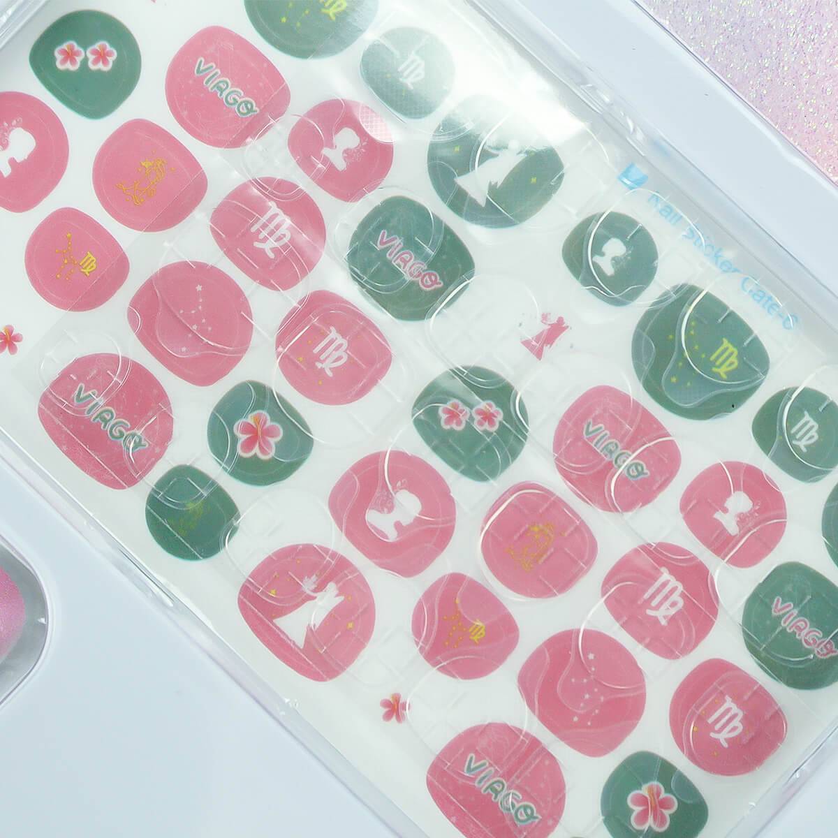 12 Zodiac Signs Kids Nail Art Set HW23158395 by HugmieToys, featuring pink and green nail stickers with zodiac symbols, perfect for creative kids' DIY nail designs.