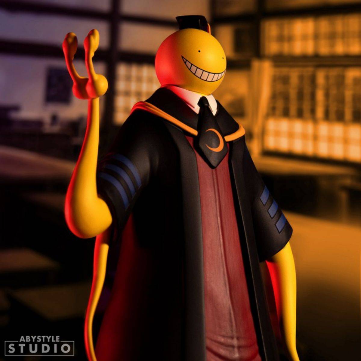 Koro Sensei figure posed in a traditional classroom setting, featuring his signature smile and academic outfit from Assassination Classroom.