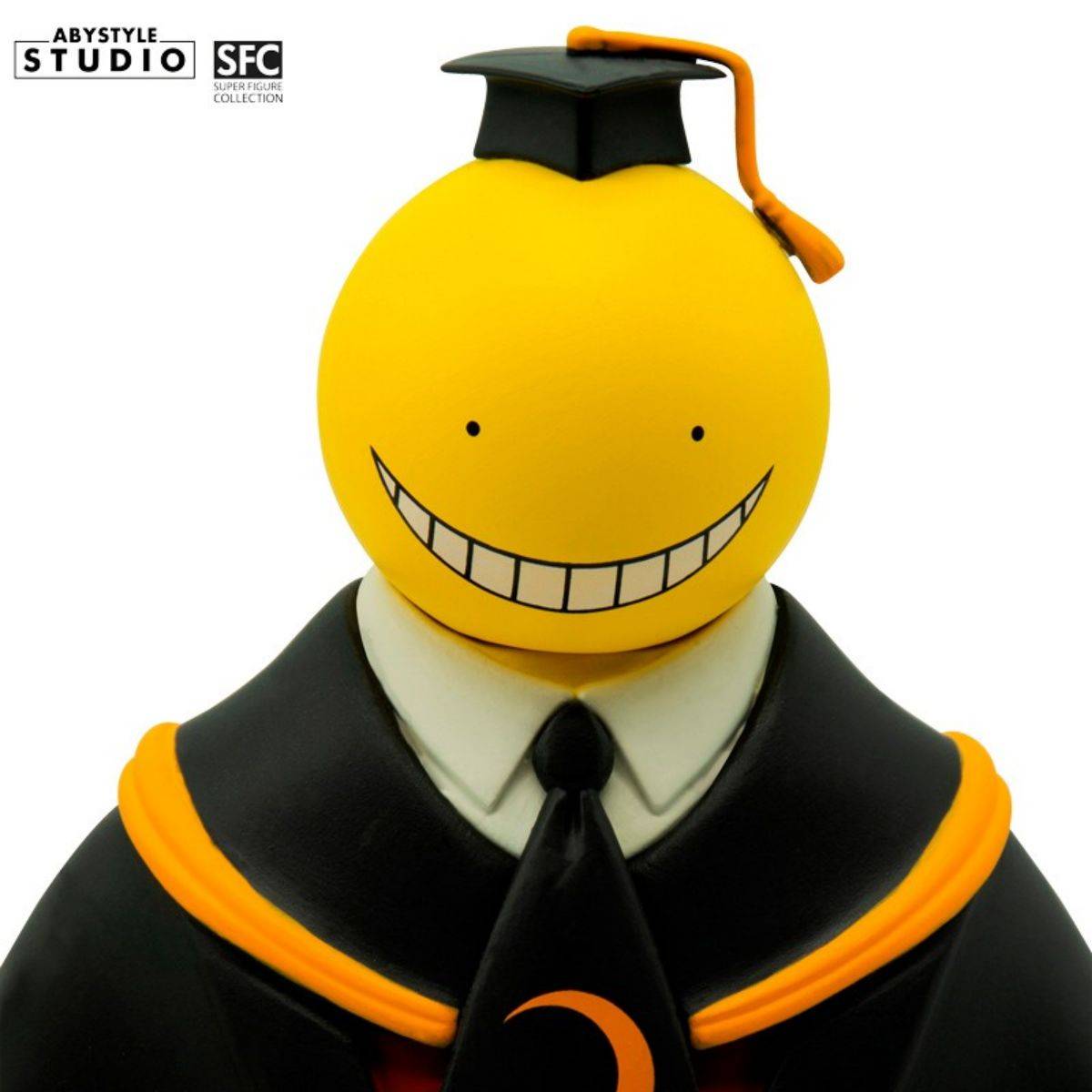 Front-facing close-up of Koro Sensei figure, capturing his cheerful expression and detailed academic uniform from the Assassination Classroom series.