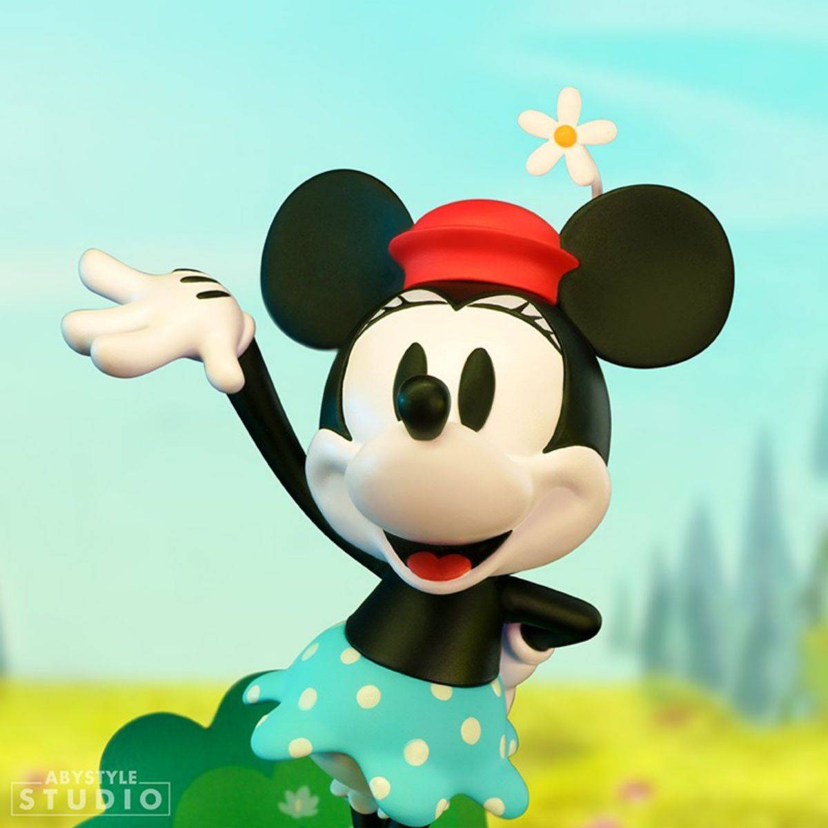 Close-up of ABYstyle Studio Disney Minnie Figure 10cm, showcasing her vintage Steamboat Willie design with a red hat and blue polka-dot skirt.