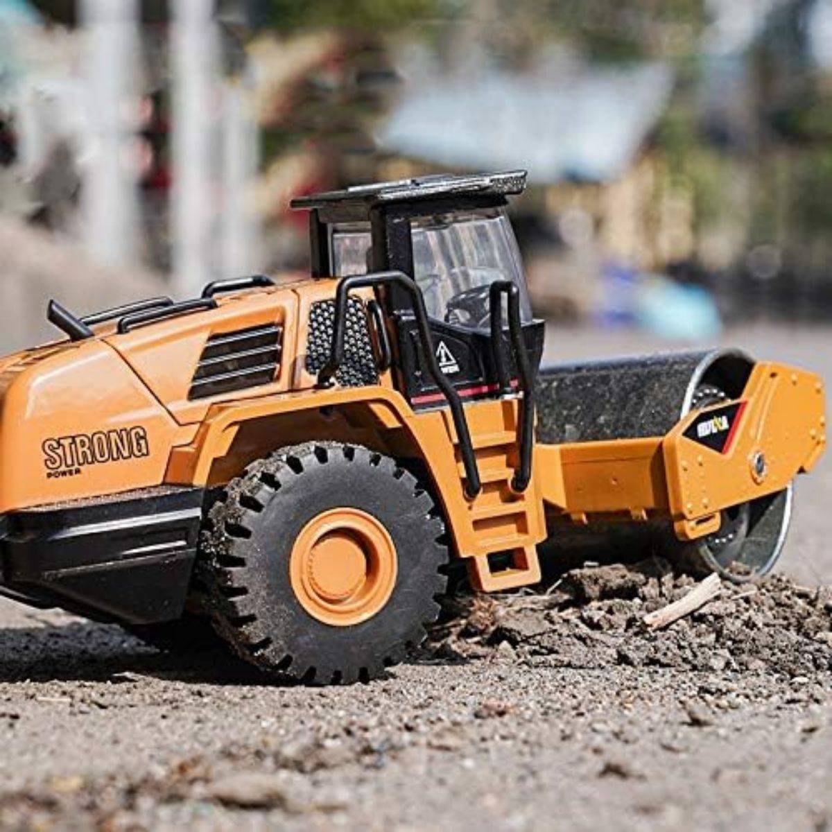 Huina 1815 1:60 Alloy Road Roller Static Model on rough terrain, highlighting its rugged build and detailed craftsmanship for realistic play.