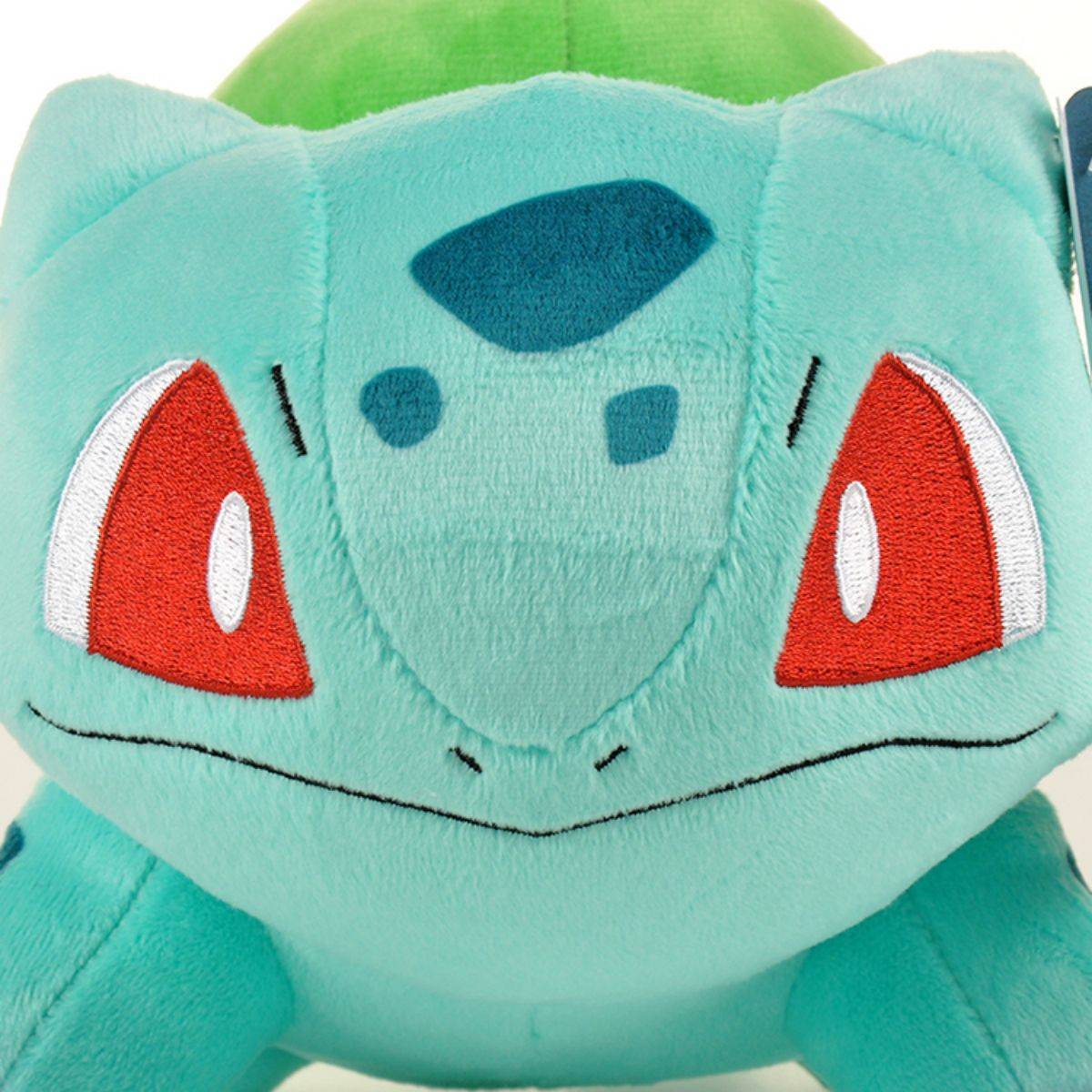 Close-up of the Pokemon Bulbasaur Plush Toy 33cm, emphasizing its embroidered facial details and soft, huggable material.
