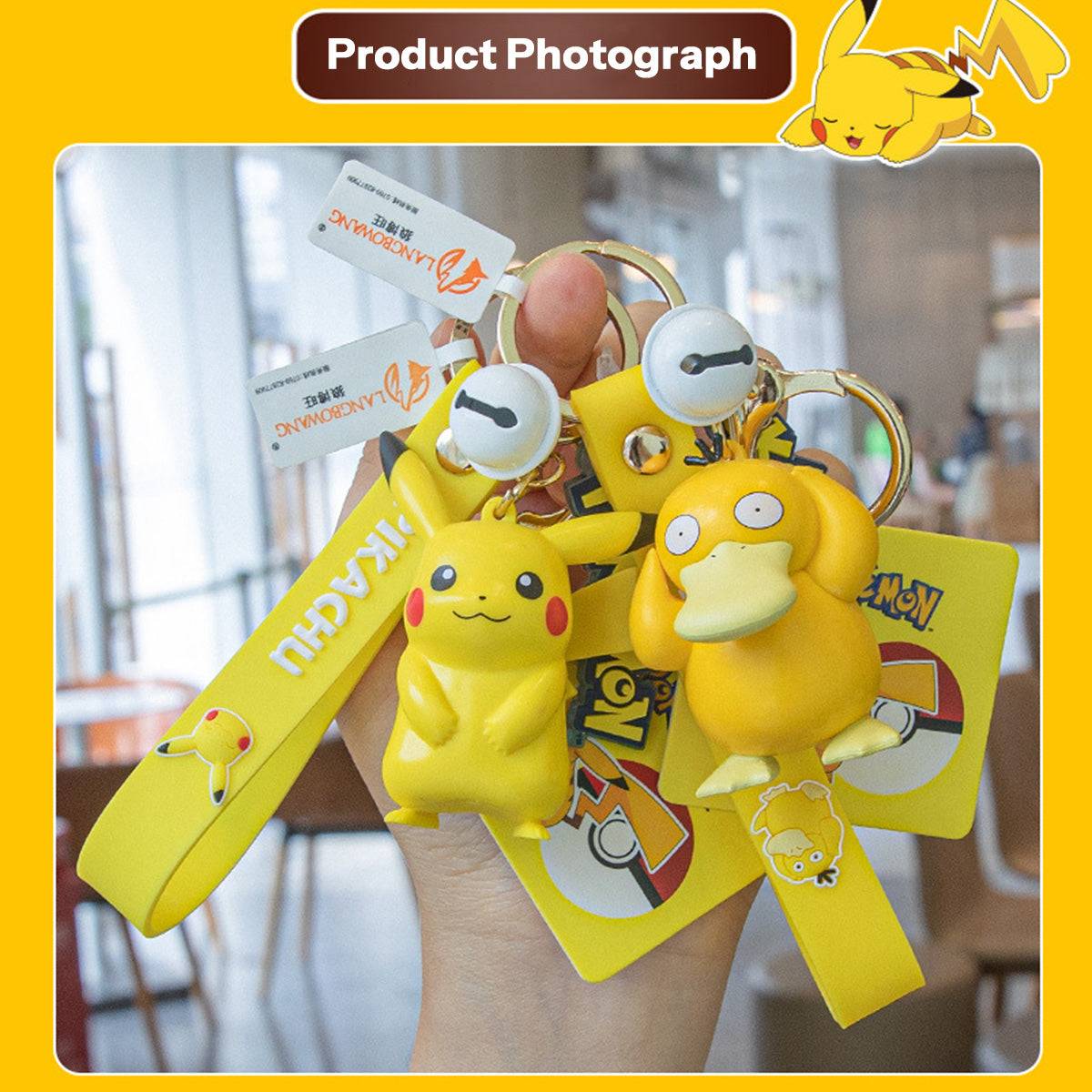 Hand holding Pikachu and Psyduck Pokemon figure keychains. A fun and stylish anime collectible for Pokemon fans.
