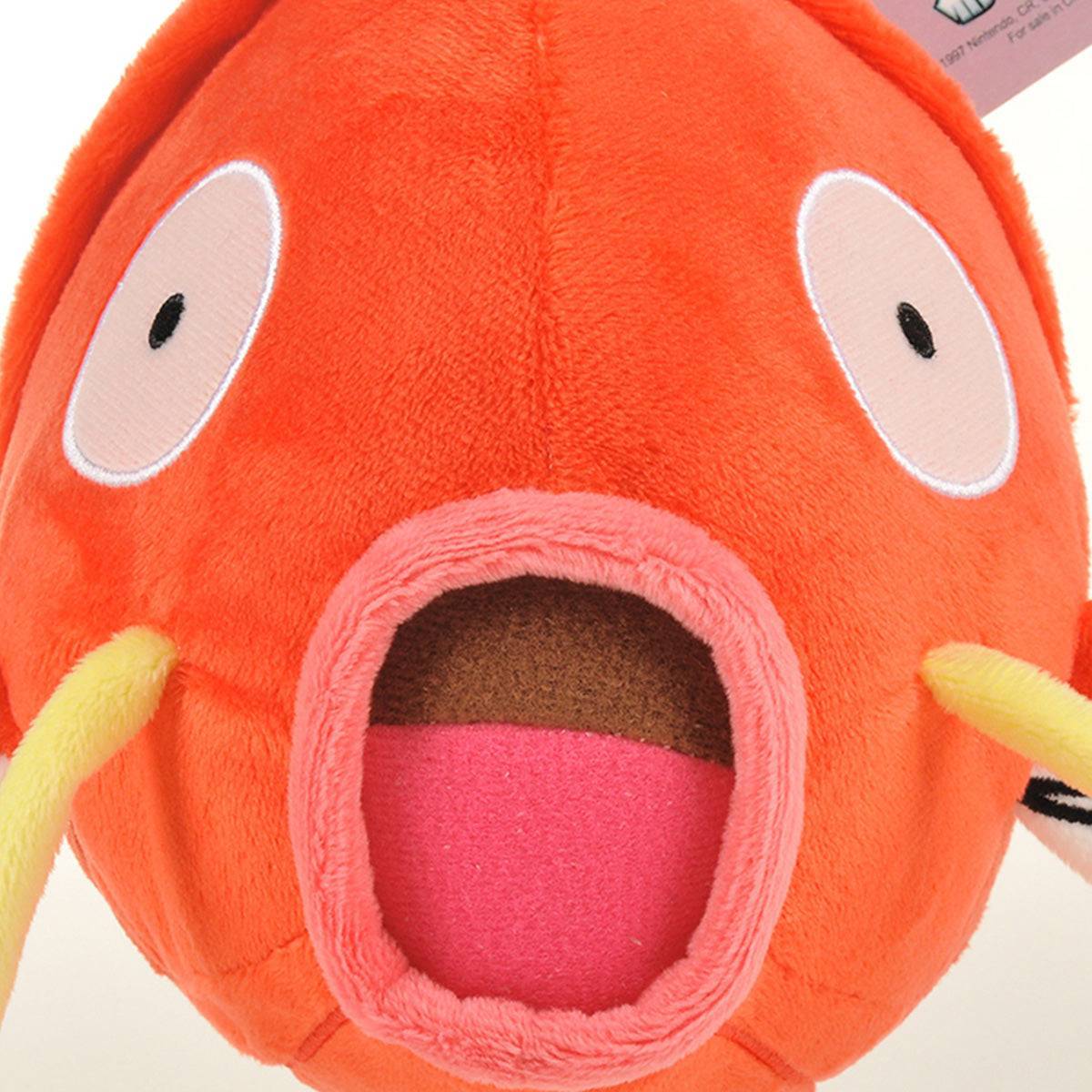 Close-up of the Pokemon Magikarp Plush Toy 25cm’s face, featuring embroidered eyes and an open mouth. A charming plush for Pokemon fans of all ages.