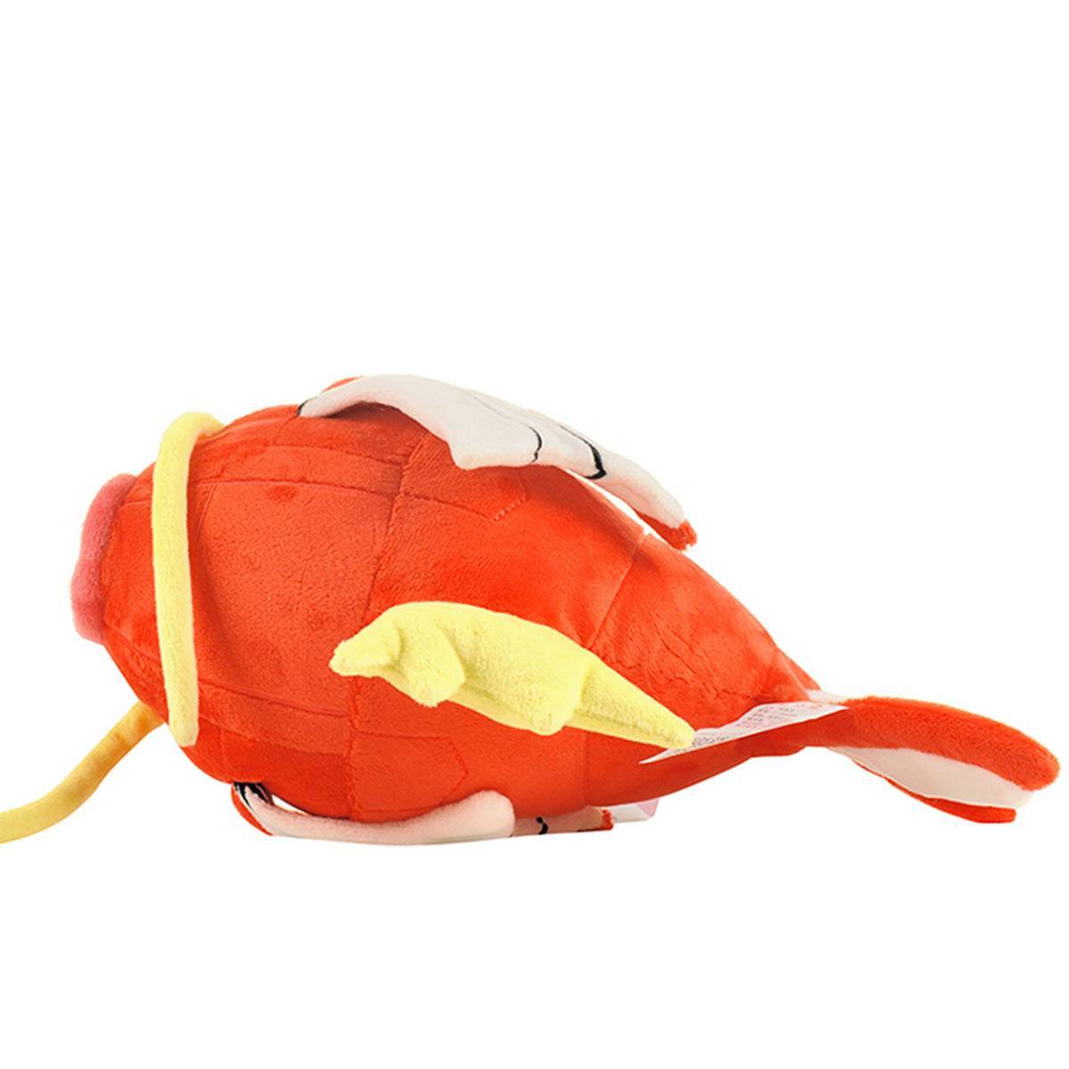 Pokemon Magikarp Plush Toy 25cm lying on its side, displaying its soft texture and high-quality craftsmanship. Perfect for cuddling and gifting.