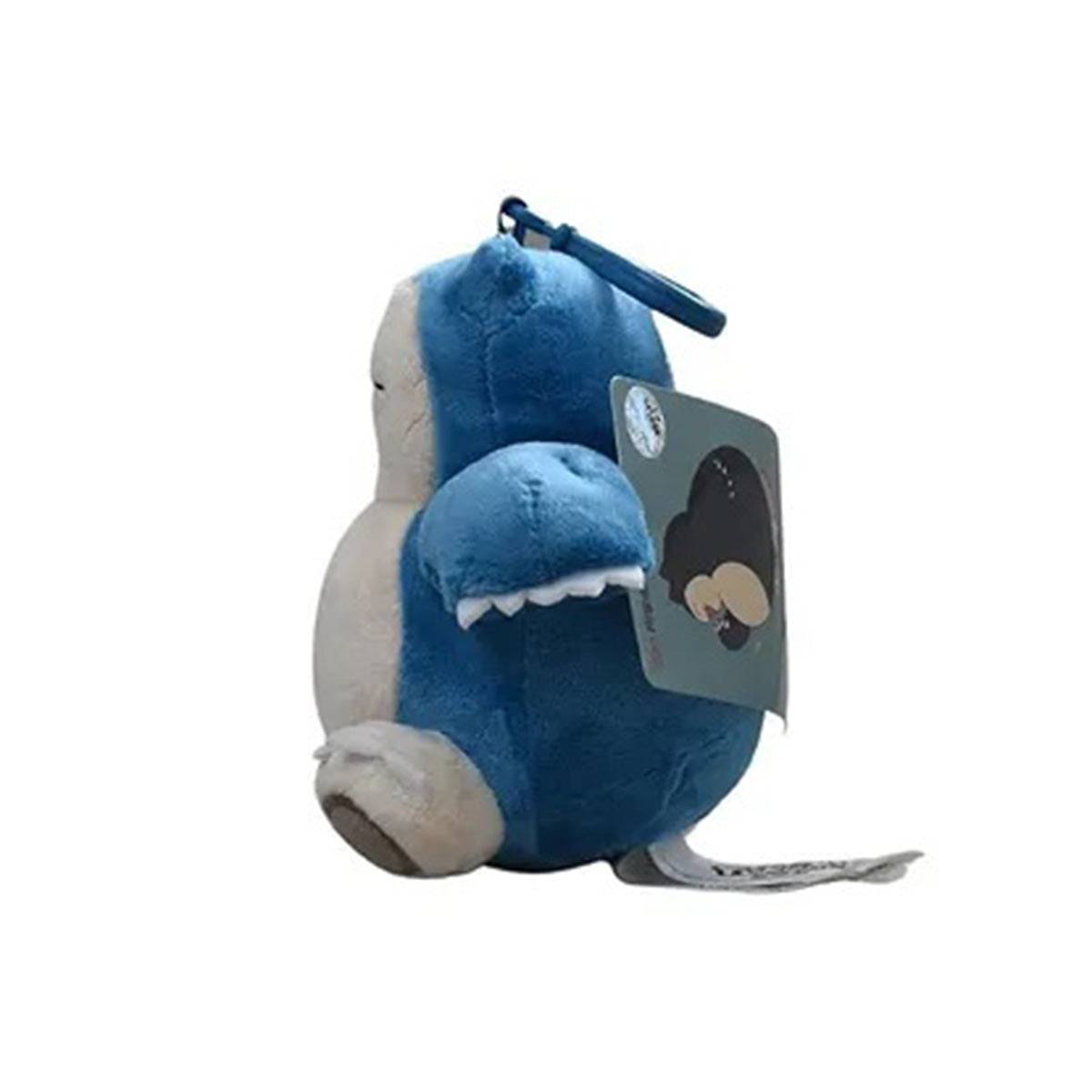 Side view of the Pokemon Plush Snorlax Keychain 13.5cm with a tag, showing its plush texture and detailed stitching for an authentic look.