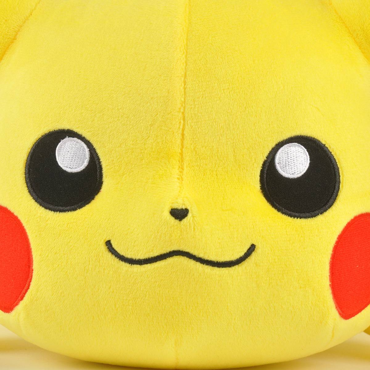 Close-up of Pokemon Stuffed Plush Toys Lying Pikachu 40cm’s face, featuring its embroidered eyes, red cheeks, and soft plush fabric for a cuddly feel.