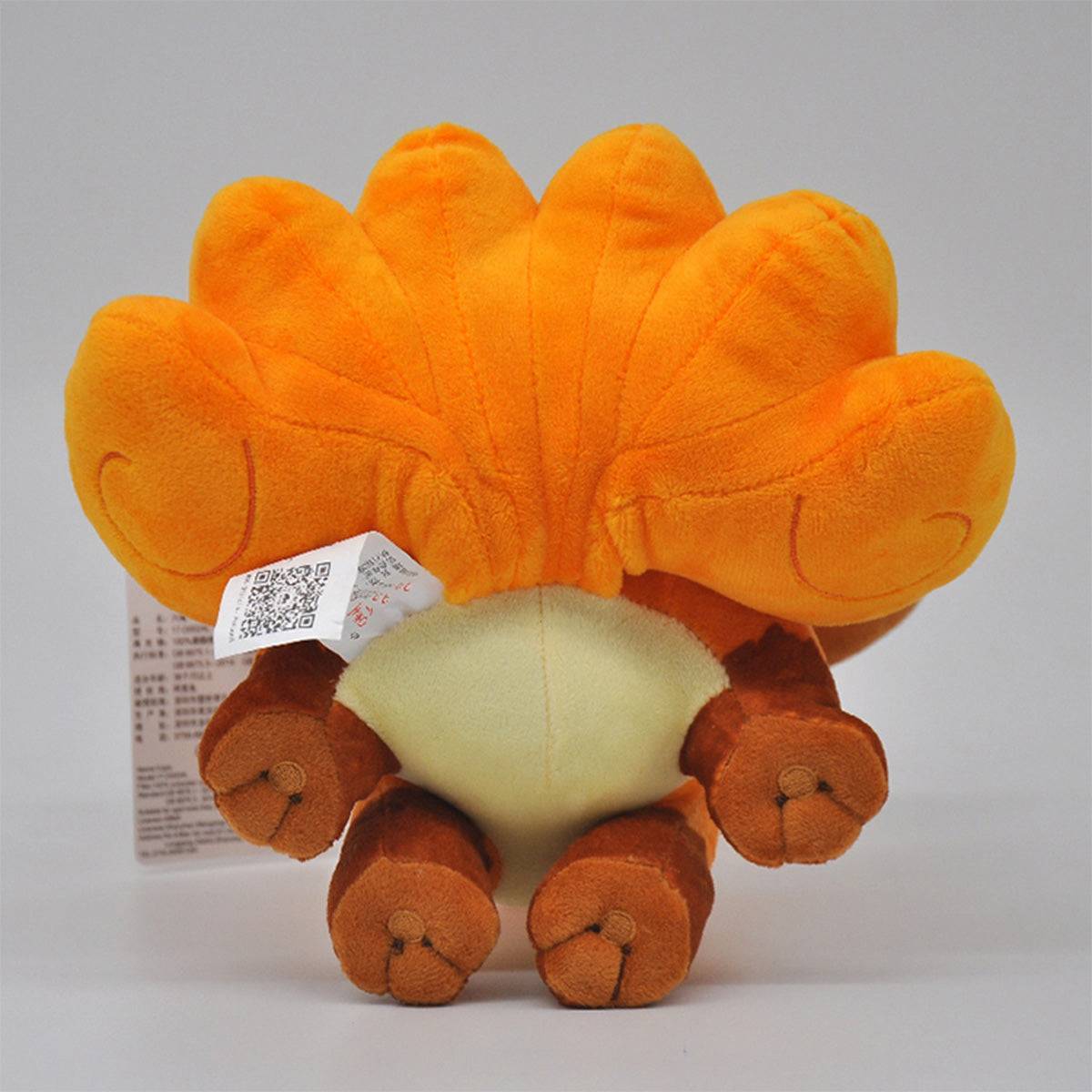 Bottom view of the Pokemon Vulpix Plush Toy 24cm, displaying its soft paws and plush texture. A cozy and huggable toy for Pokemon enthusiasts.