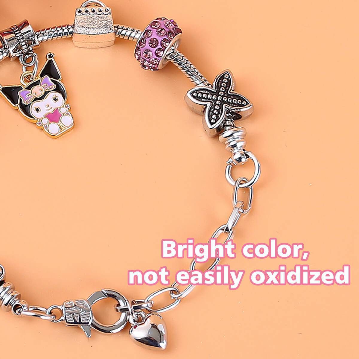 Detailed view of the S073 Sanrio Cute Anime Alloy Charm Bracelet with Kuromi charm. Bright colors and durable metal charms.