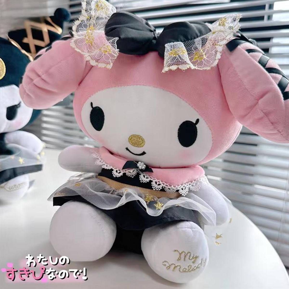 Adorable My Melody plush toy in black and gold theme, sitting elegantly with lace and bow details. A charming addition to any Sanrio collection.