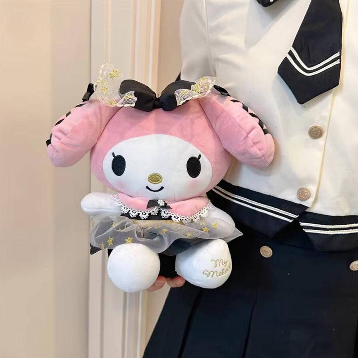 Person holding Sanrio Black Gold Series My Melody plush toy, highlighting its 23cm size and soft texture. A stylish and cuddly collectible.