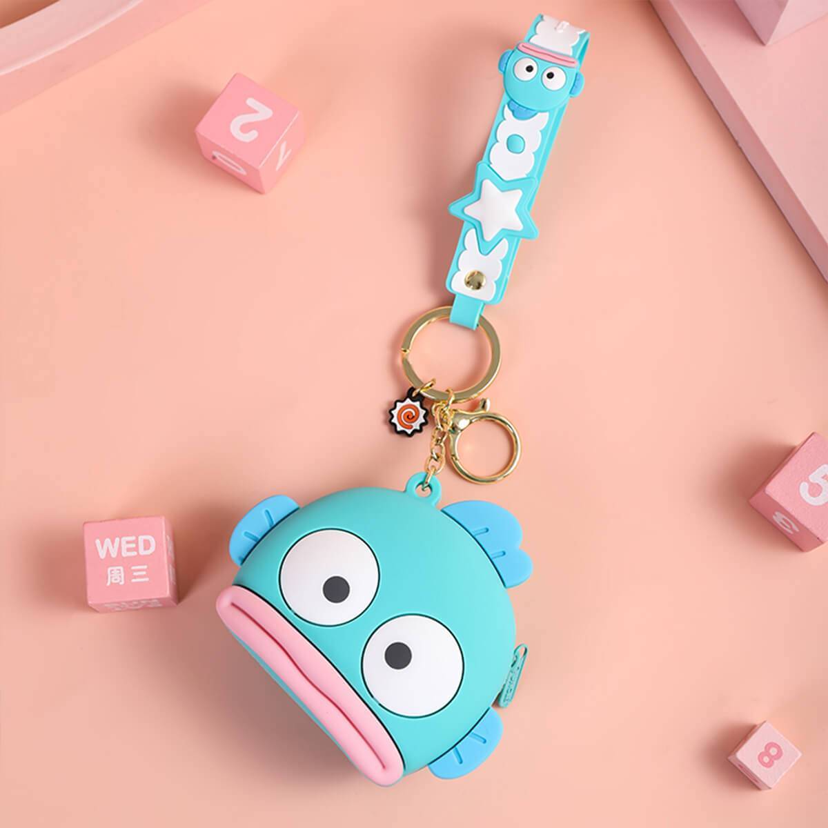 Blue fish-shaped Sanrio Cartoon Silicone Coin Purse Keychain with a matching strap and keyring. A cute and practical gift for all occasions.