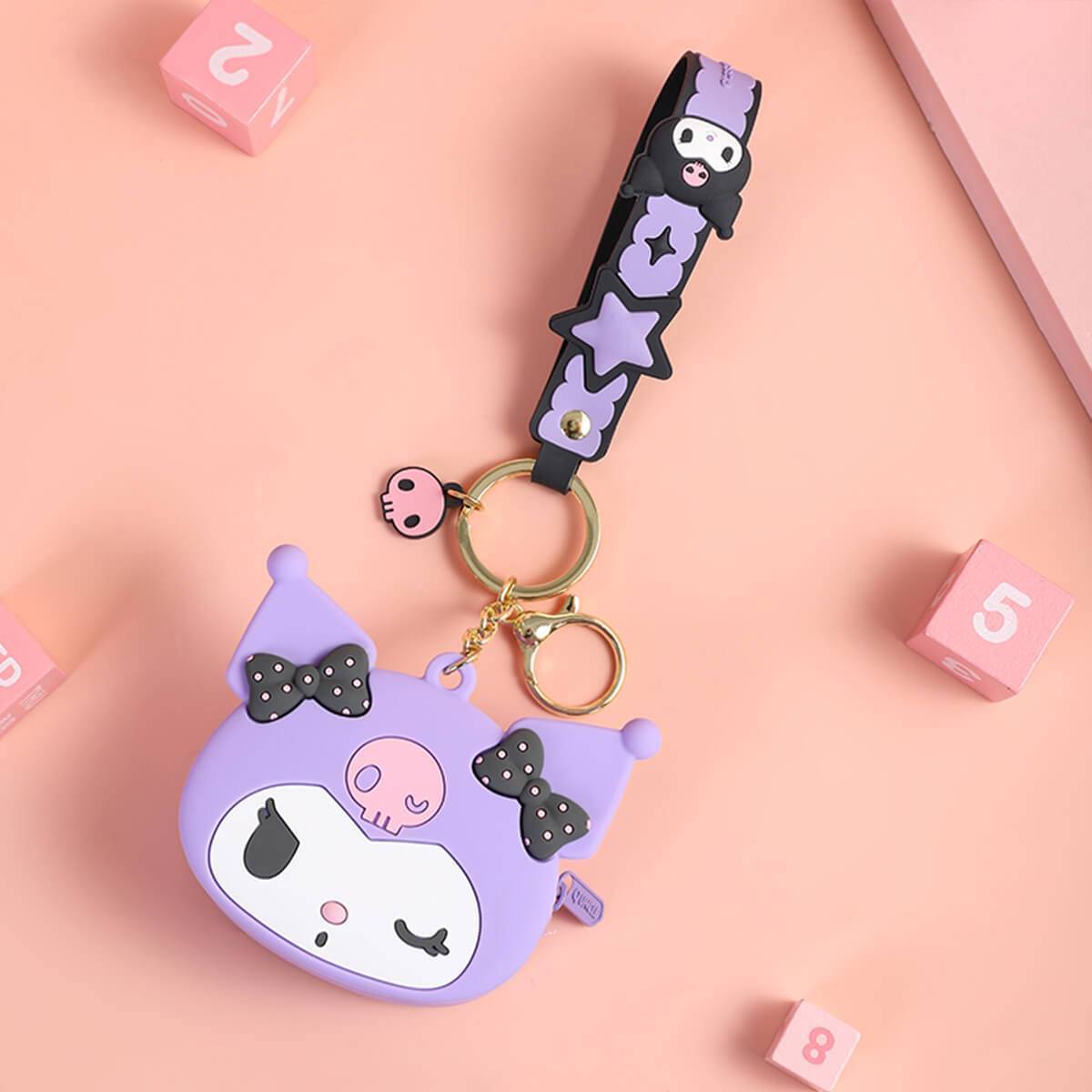 Purple Kuromi Sanrio Cartoon Silicone Coin Purse Keychain with a matching strap and keyring. A stylish and functional accessory for fans.
