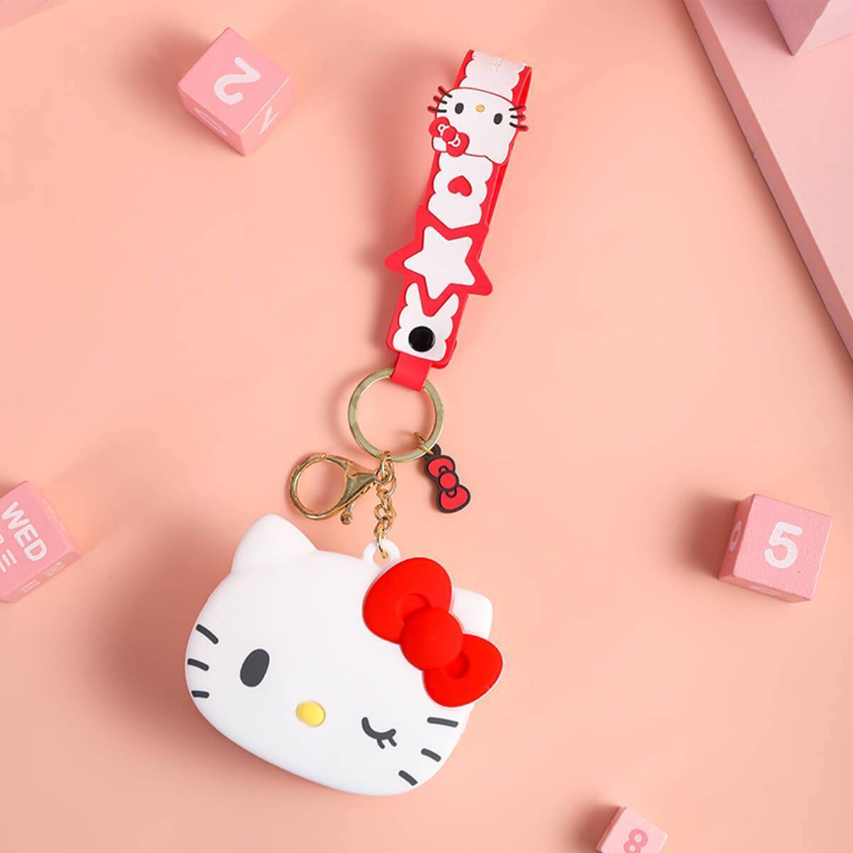 Hello Kitty-themed Sanrio Cartoon Silicone Coin Purse Keychain in white with a red bow. Features a matching strap and keyring for convenience.