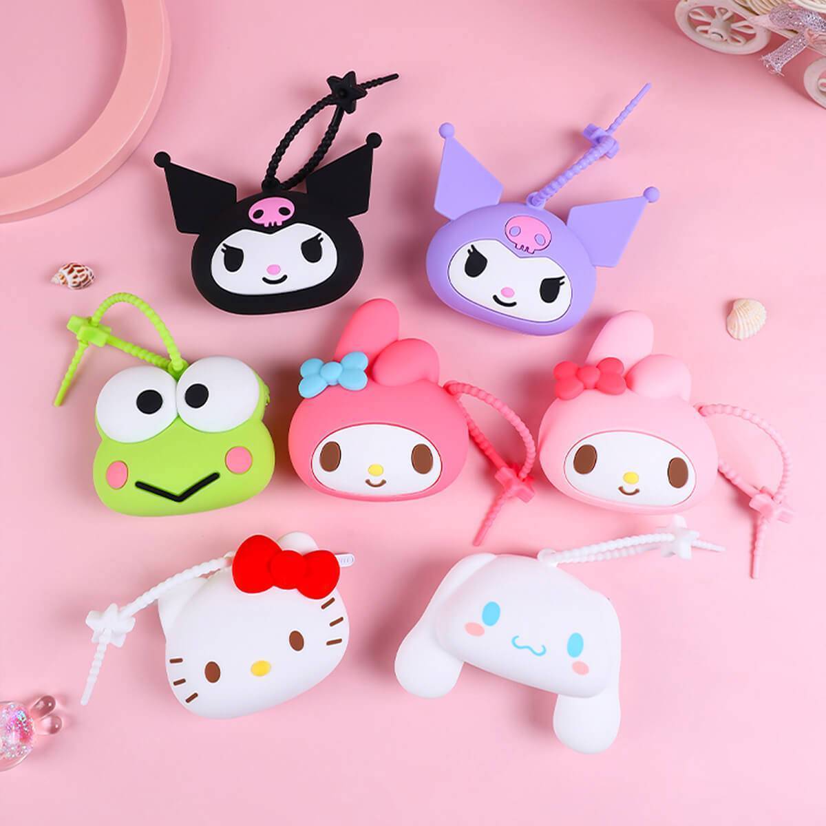 Sanrio character silicone coin purses displayed with decorative elements. Features My Melody, Kuromi, Cinnamoroll, and more in vibrant colors.