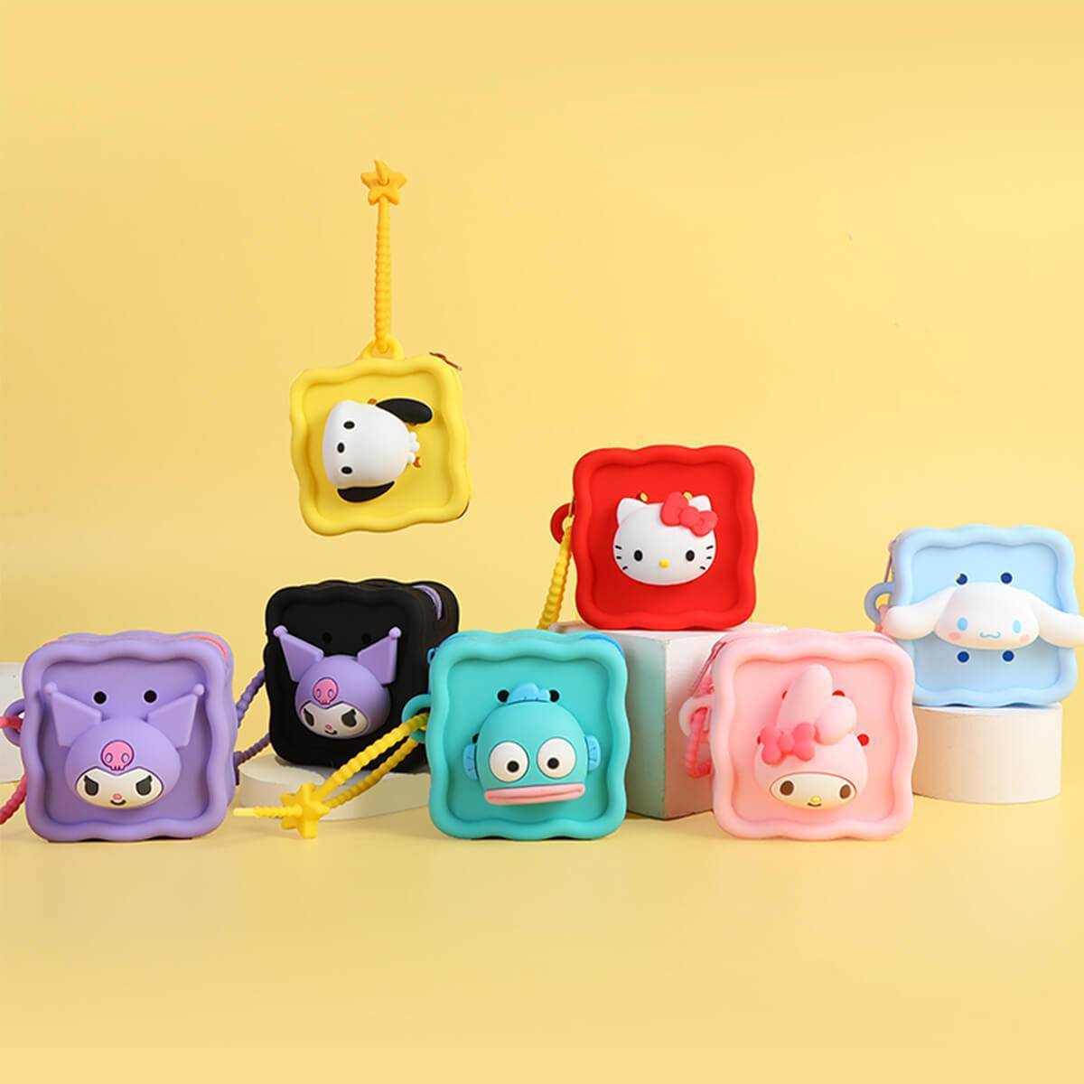 Collection of Sanrio Cartoon Silicone Mini Pouches featuring various characters like Hello Kitty, Kuromi, and My Melody. Fun and practical storage solutions.