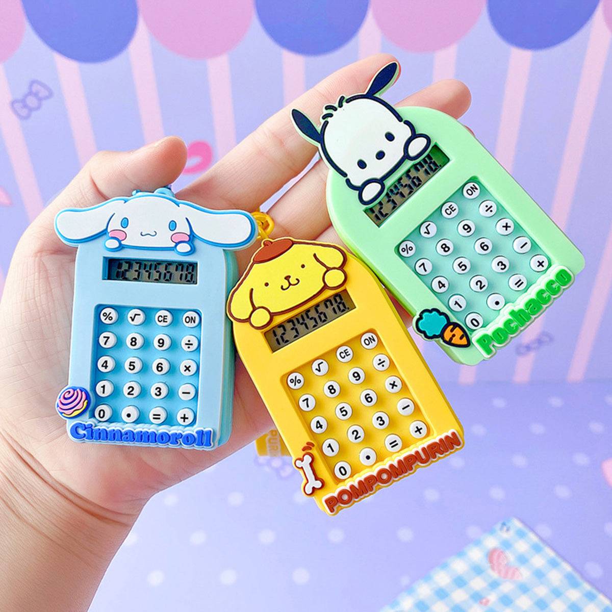 Cinnamoroll, Pompompurin, and Pochacco Sanrio Characters Cute Cartoon Calculator Keychains with mini calculators.