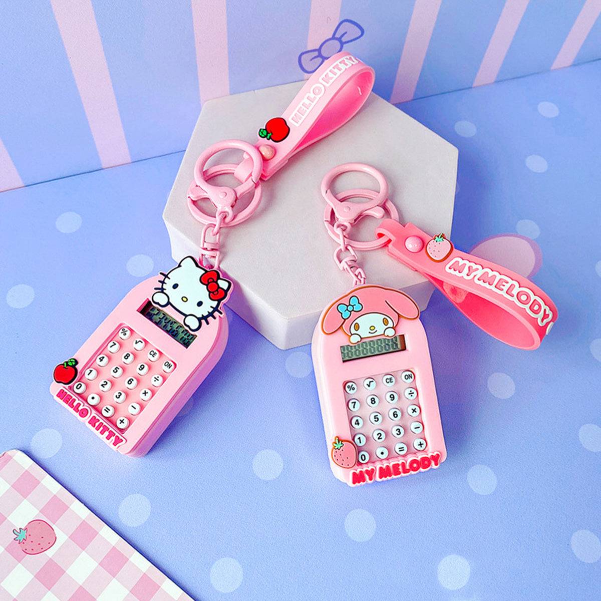 Hello Kitty and My Melody Sanrio Characters Cute Cartoon Calculator Keychains with pink designs and keychain attachments.