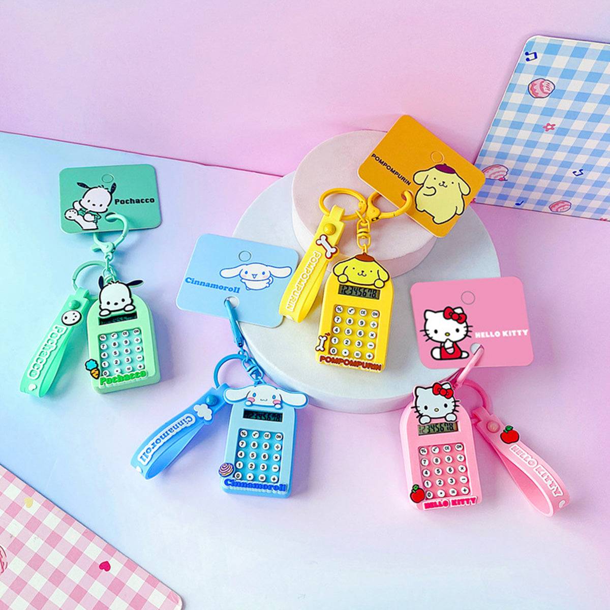 Sanrio Characters Cute Cartoon Calculator Keychains with packaging, featuring Hello Kitty, Pochacco, Cinnamoroll, and Pompompurin.