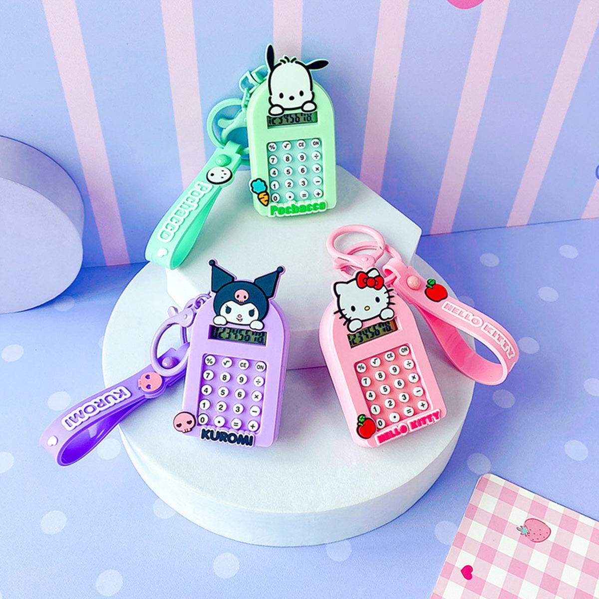 Assorted Sanrio Characters Cute Cartoon Calculator Keychains including Kuromi, Hello Kitty, and Pochacco on a pastel background.