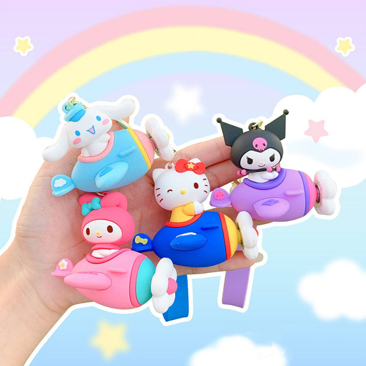 Sanrio Airplane Keychains held in hand, featuring Hello Kitty, My Melody, Kuromi, and Cinnamoroll. A fun and colorful collection for fans.