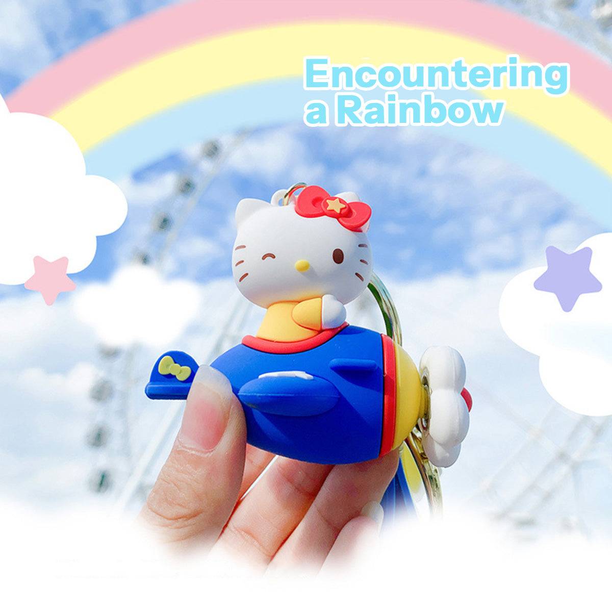 Hello Kitty Airplane Keychain held against a rainbow sky background. A whimsical and adorable collectible for Sanrio fans.