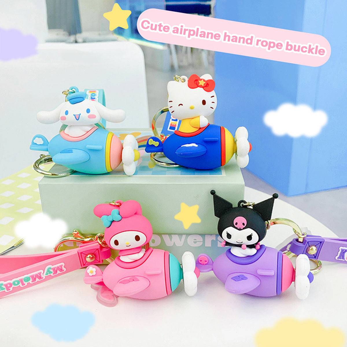 Sanrio Airplane Keychains displayed on a pastel background, featuring Hello Kitty, My Melody, Kuromi, and Cinnamoroll. A must-have for collectors.