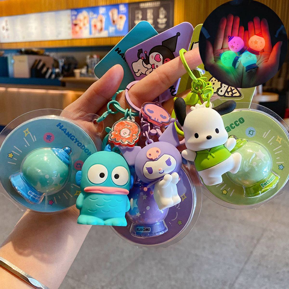 Sanrio Characters Keychains with Night Lights featuring Kuromi and Pochacco. A vibrant and collectible keychain set for fans.