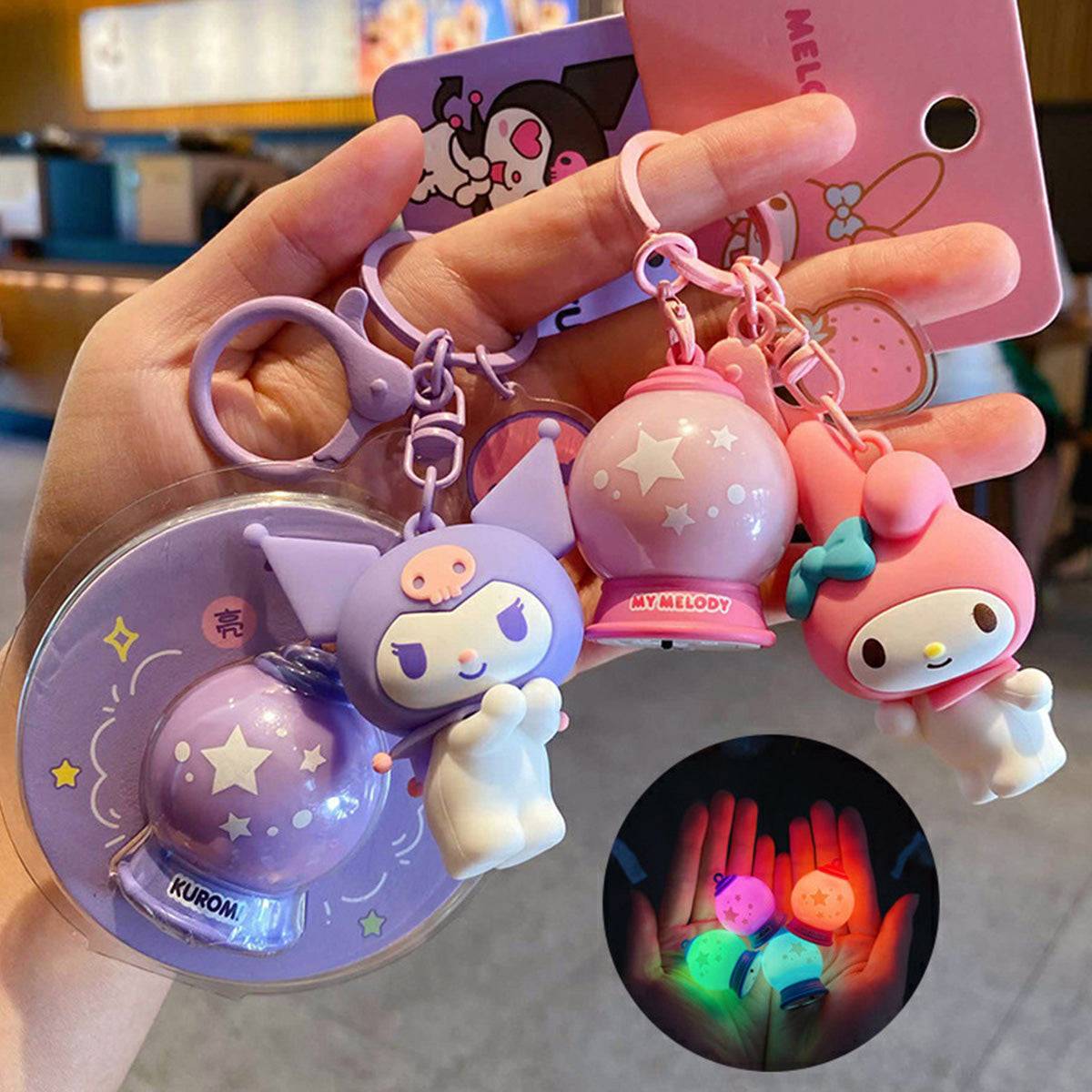 Sanrio Characters Keychains with Night Lights featuring Kuromi and My Melody. A cute and glowing accessory set for Sanrio lovers.