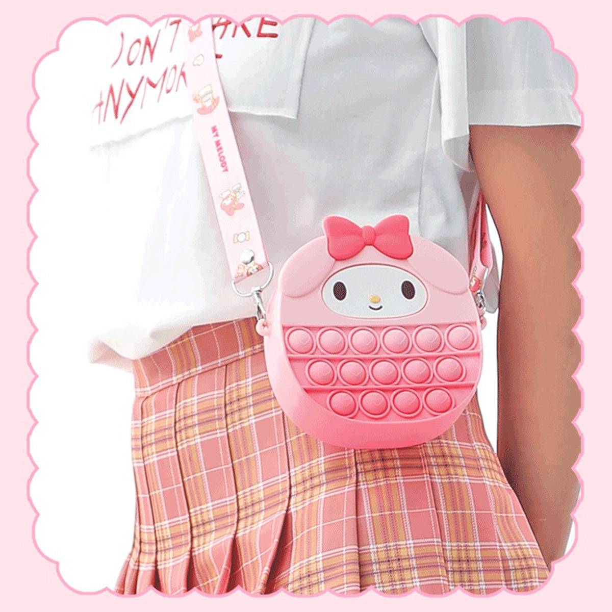 My Melody-themed Sanrio Characters Pop It Bag worn crossbody by a model, highlighting its stylish design and adjustable strap for comfortable wear.