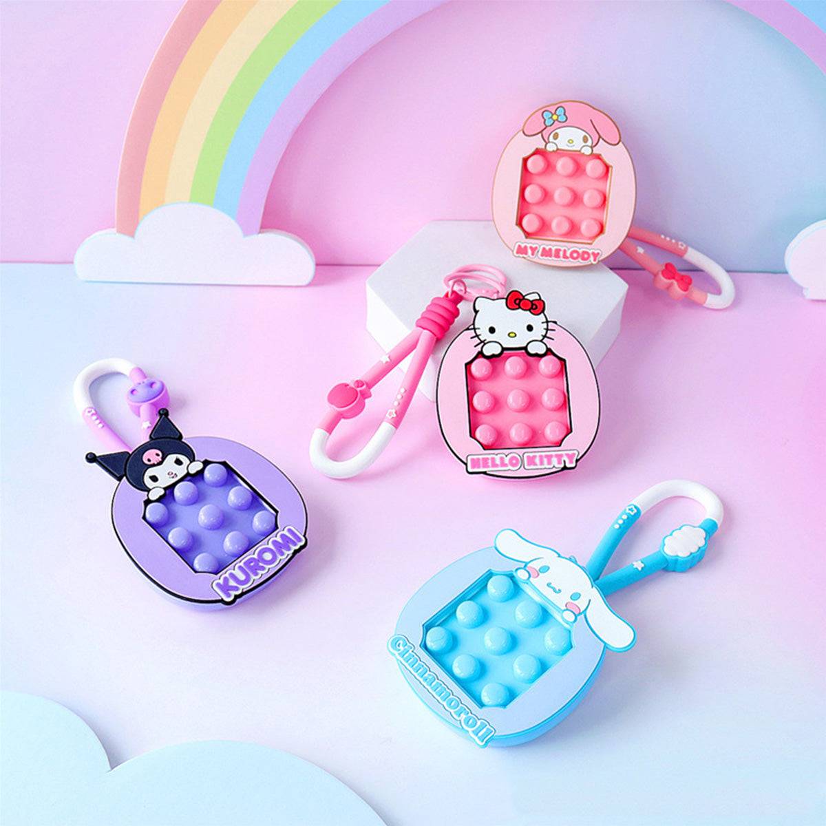 Sanrio Pop It Fidget Keychains featuring Kuromi, Hello Kitty, My Melody, and Cinnamoroll. A cute and functional accessory for fidgeting.