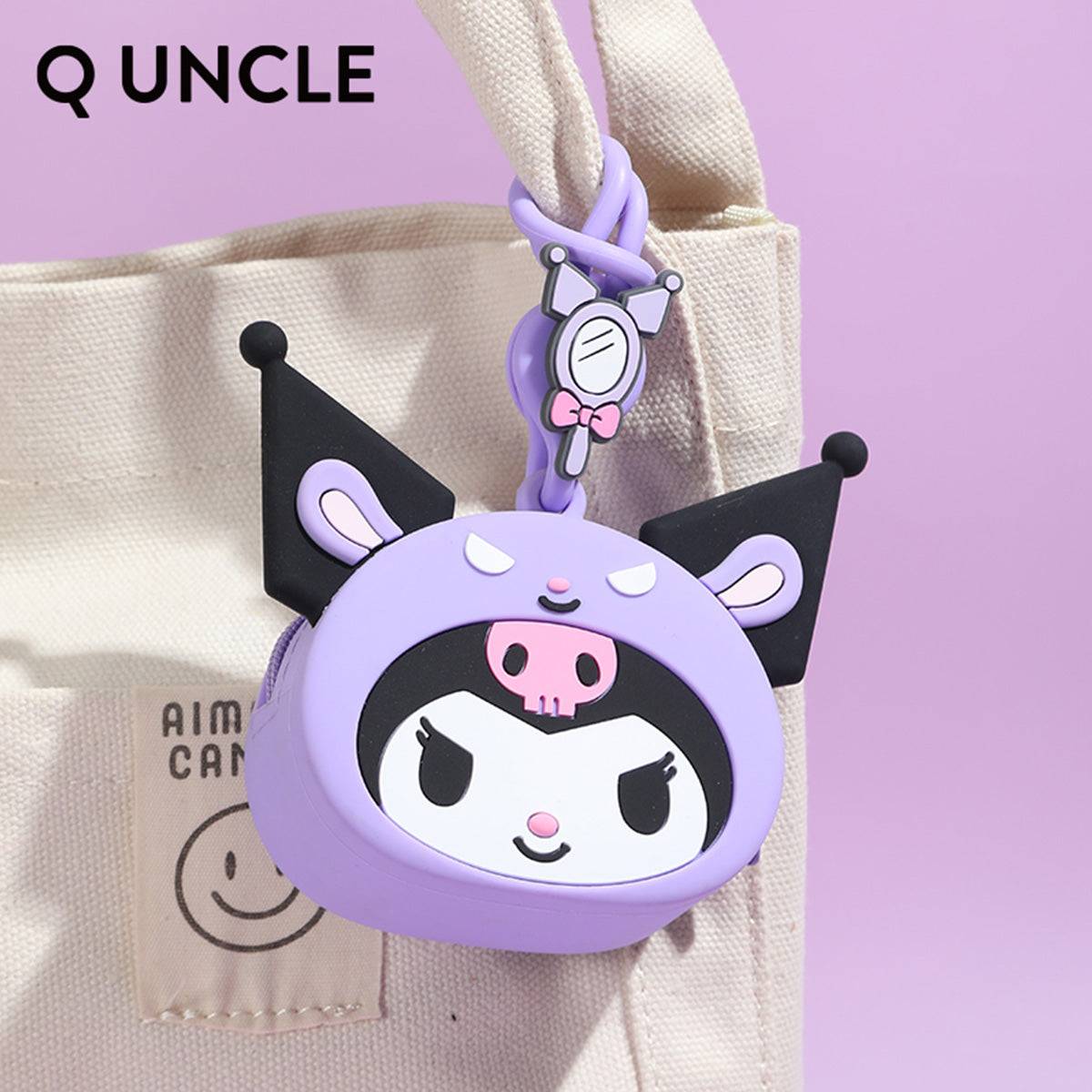 Kuromi silicone coin purse attached to a beige tote bag, highlighting its portability. A cute and functional accessory for everyday use.